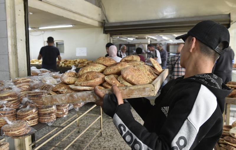 Lebanese Workers breaking years of fasting on a peanut Image